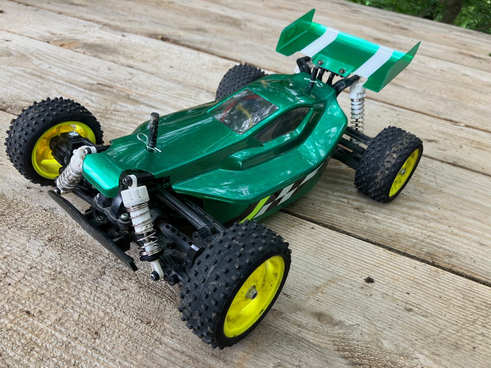 Green Tamiya Plasma Edge II RC buggy with yellow wheels at RC Garage Vienna